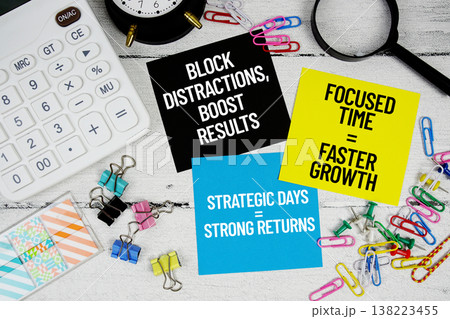 Block Distractions Boost Results, Focused Time Faster Growth, Strategic Days Strong Returns text written on paper note with calculator and magnifying glass on wooden background Block Distractions Boost Results, Focused Time Faster Growth, Strategic Days Strong Returns text written on paper note with calculator and magnifying glass on wooden background 138223455