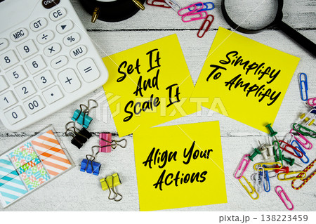 Set It And Scale It, Simplify To Amplify, Align Your Actions text written on paper note with calculator and magnifying glass on wooden background Set It And Scale It, Simplify To Amplify, Align Your Actions text written on paper note with calculator and magnifying glass on wooden background 138223459