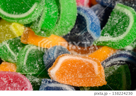 Colorful gummy candies sprinkled with sugar create a vibrant and tempting display of sweetness and joy in a delightful treat 138224230