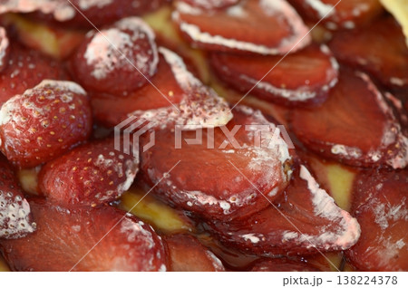 Layers of fresh strawberries atop a creamy dessert create a delightful summer treat enjoyed during sunny afternoons 138224378