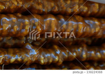 Deliciously sticky dessert treats showcasing rich textures and vibrant sweetness from a popular market stall 138224388