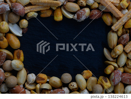Colorful assortment of nuts and snacks creates an inviting frame for culinary creativity 138224613