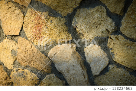 Stone Wall Background with Rays of Sunlight 138224662
