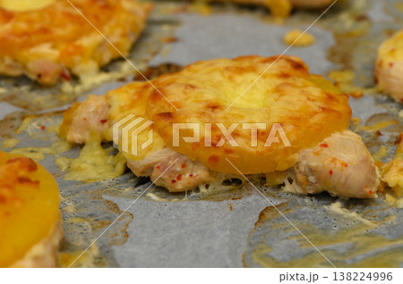 Delightful baked chicken topped with pineapple and melted cheese creating savory 138224996