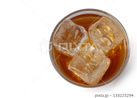 Glass of Whiskey with Ice Isolated on White Background Glass of Whiskey with Ice Isolated on White Background 138225294
