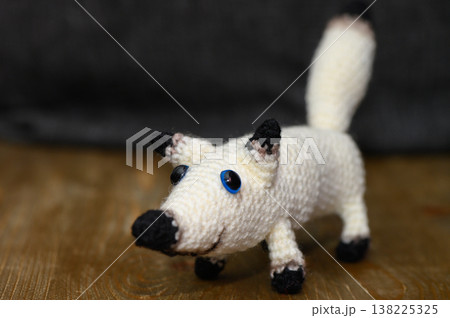 White Yarn Knitted Dog Handmade on Dark Background White Yarn Knitted Dog Handmade on Dark Background 138225325