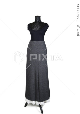 Clothing Set: Wool Skirt and a Beautiful Belt on a Dress Form on White Background. Fashion Look. 138225445