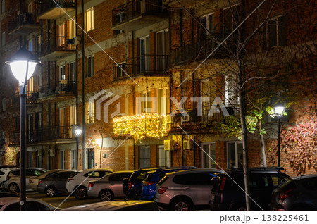 Night Street in a Residential District of Tbilisi. Lit Entrances, Parked Cars, and Trees. 138225461