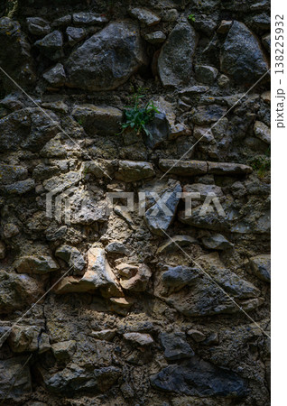 Old Stone Wall with Light Spots in St. Hilarion Castle, Northern Cyprus 138225932