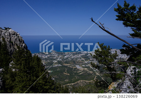View from ancient Saint Hilarion Castle overlooking Kyrenia city and the vast blue sea. A perfect blend of history and nature. View from ancient Saint Hilarion Castle overlooking Kyrenia city and the vast blue sea. A perfect blend of history and nature. 138226069