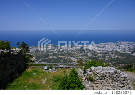 Panoramic view from Saint Hilarion Castle showing Kyrenia town and sparkling Mediterranean coastline. A top sightseeing point in Cyprus. 138226079