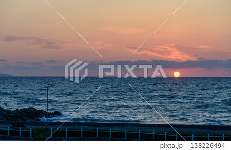 The sun dips into the Mediterranean Sea off the coast of Cyprus, painting the sky with vibrant orange and red hues in a breathtaking evening view. The sun dips into the Mediterranean Sea off the coast of Cyprus, painting the sky with vibrant orange and red hues in a breathtaking evening view. 138226494
