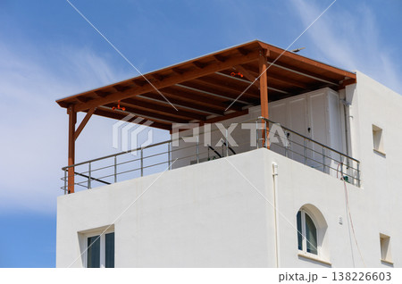 Cluster of white Mediterranean villas on a hillside in Cyprus, surrounded by sunlight and natural beauty. Cluster of white Mediterranean villas on a hillside in Cyprus, surrounded by sunlight and natural beauty. 138226603
