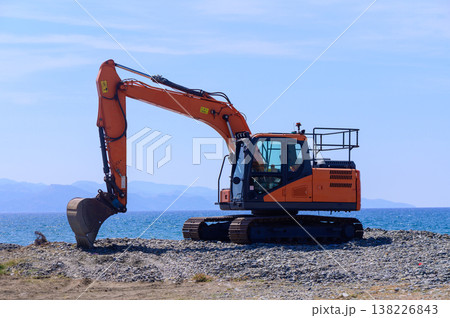 Orange Excavator on Seaside in Cyprus 138226843