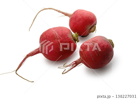 Three red radishes on white background 138227031