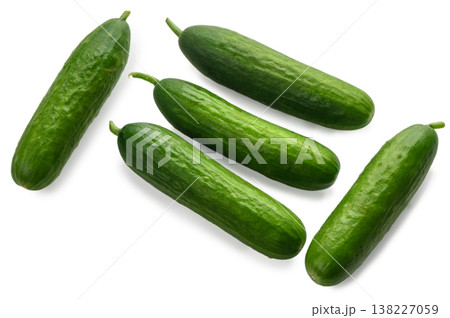 Five mini cucumbers arranged on white background Five mini cucumbers arranged on white background 138227059