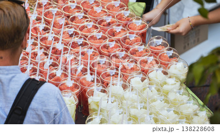 Watermelon fruit in plastic cups at Moscow market Watermelon fruit in plastic cups at Moscow market 138228608