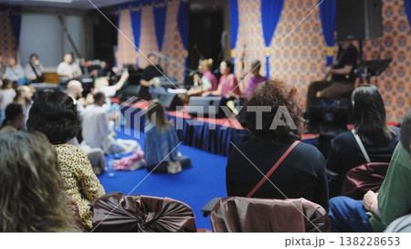 Audience at Ganesh Chaturthi festival experiencing devotional music kirtan performance 138228653