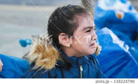 Unhappy child crying with tears during a moment of sadness and emotional distress Unhappy child crying with tears during a moment of sadness and emotional distress 138228790