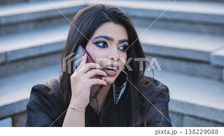 Young Indian woman talking on smartphone in Moscow Young Indian woman talking on smartphone in Moscow 138229088