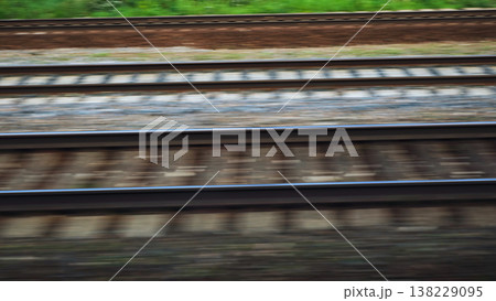 Multiple railway tracks stretching into distance creating a transportation network Multiple railway tracks stretching into distance creating a transportation network 138229095