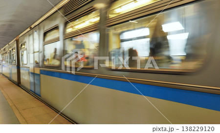 Subway train moving fast through a station, motion blur capturing speed and transit 138229120
