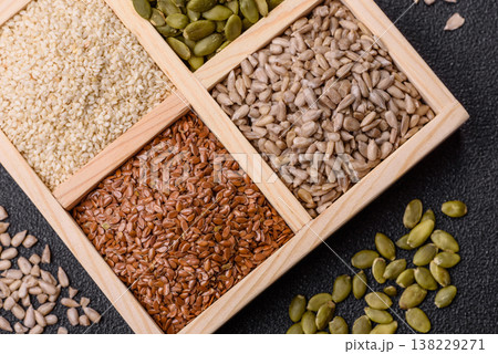 Flax, pumpkin, sunflower, and sesame seeds, ingredients for healthy eating Flax, pumpkin, sunflower, and sesame seeds, ingredients for healthy eating 138229271