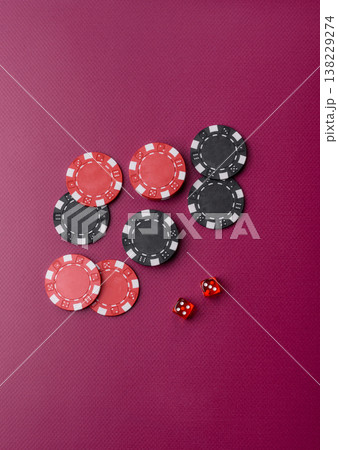 Casino dice and chips on a colored background, poker, gambling with bets. Dice and chips 138229274