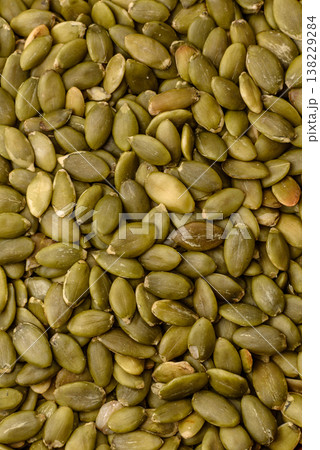 Shelled pumpkin seed kernels, salted, roasted, or raw, are a healthy ingredient. Pumpkin seeds Shelled pumpkin seed kernels, salted, roasted, or raw, are a healthy ingredient. Pumpkin seeds 138229284