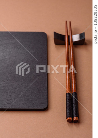 Wooden bamboo chopsticks for sushi and other Asian food with a blank background. Wooden chopsticks Wooden bamboo chopsticks for sushi and other Asian food with a blank background. Wooden chopsticks 138229335
