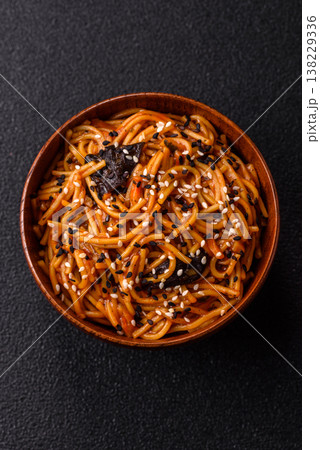Yakisoba, Asian noodles with vegetables and meat, is a Japanese spicy food. Yakisoba or udon Yakisoba, Asian noodles with vegetables and meat, is a Japanese spicy food. Yakisoba or udon 138229336