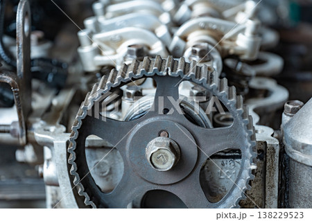 Automotive engine showing internal timing belt system, gears, and mechanical parts 138229523