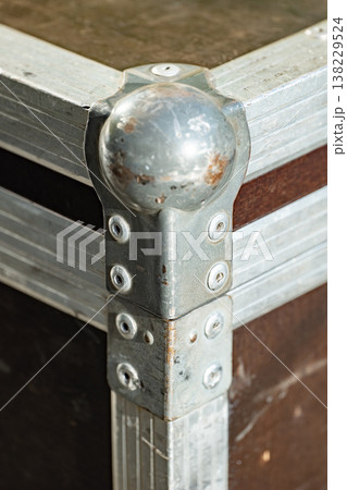 Close up of an aluminum flight case corner protecting valuable road equipment 138229524