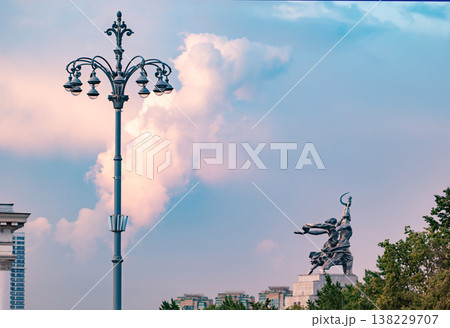 Worker and Kolkhoz Woman monument in Moscow against a colorful sunset sky Worker and Kolkhoz Woman monument in Moscow against a colorful sunset sky 138229707