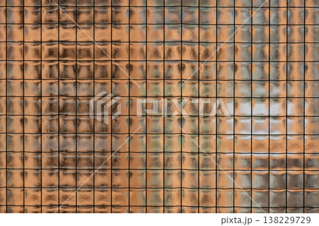 Textured wired glass surface creating abstract pattern with light and shadow reflections Textured wired glass surface creating abstract pattern with light and shadow reflections 138229729