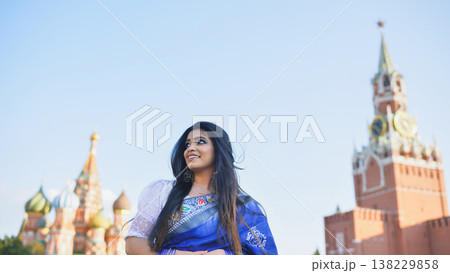 Bangladeshi woman in Moscow enjoying Red Square views, wearing traditional saree Bangladeshi woman in Moscow enjoying Red Square views, wearing traditional saree 138229858