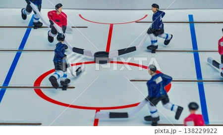 Table hockey players skating on ice during a match 138229922