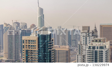 Aerial top view of Dubai Marina morning timelapse. Modern towers and traffic on the road Aerial top view of Dubai Marina morning timelapse. Modern towers and traffic on the road 138229974