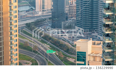 Aerial view of a road intersection in a big city timelapse. Aerial view of a road intersection in a big city timelapse. 138229990