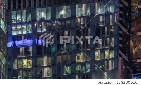 Night view of exterior apartment tower timelapse. High rise skyscraper with blinking lights in windows Night view of exterior apartment tower timelapse. High rise skyscraper with blinking lights in windows 138230010