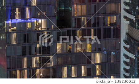 Night view of exterior apartment tower timelapse. High rise skyscraper with blinking lights in windows Night view of exterior apartment tower timelapse. High rise skyscraper with blinking lights in windows 138230012
