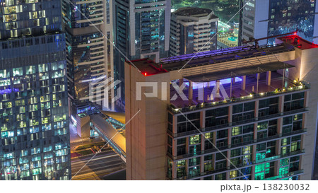 Skyline of the buildings of Sheikh Zayed Road and DIFC aerial night timelapse in Dubai, UAE. Skyline of the buildings of Sheikh Zayed Road and DIFC aerial night timelapse in Dubai, UAE. 138230032