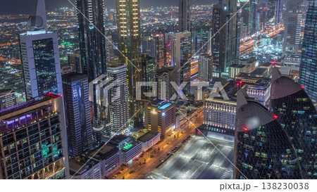 Skyline of the buildings of Sheikh Zayed Road and DIFC aerial night timelapse in Dubai, UAE. Skyline of the buildings of Sheikh Zayed Road and DIFC aerial night timelapse in Dubai, UAE. 138230038