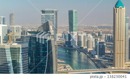 Aerial skyline of Dubai's business bay with skyscrapers timelapse before sunset. Aerial skyline of Dubai's business bay with skyscrapers timelapse before sunset. 138230041