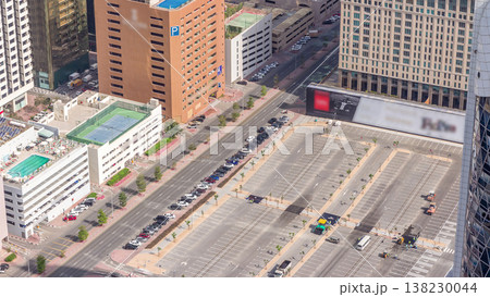 Car parking lot viewed from above timelapse, Aerial top view. Dubai, UAE Car parking lot viewed from above timelapse, Aerial top view. Dubai, UAE 138230044