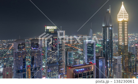 Skyline of the buildings of Sheikh Zayed Road and DIFC aerial night timelapse in Dubai, UAE. Skyline of the buildings of Sheikh Zayed Road and DIFC aerial night timelapse in Dubai, UAE. 138230061