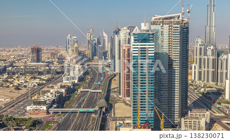 Skyscrapers on Sheikh Zayed Road and DIFC aerial timelapse in Dubai, UAE. Skyscrapers on Sheikh Zayed Road and DIFC aerial timelapse in Dubai, UAE. 138230071