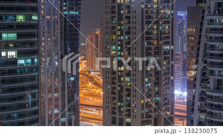 Residential and office buildings in Jumeirah lake towers district night timelapse in Dubai Residential and office buildings in Jumeirah lake towers district night timelapse in Dubai 138230075