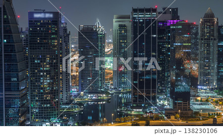 Jumeirah Lake Towers residential district aerial night timelapse near Dubai Marina 138230106