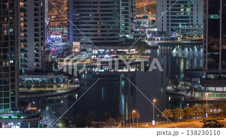 Jumeirah Lake Towers residential district aerial night timelapse near Dubai Marina Jumeirah Lake Towers residential district aerial night timelapse near Dubai Marina 138230110